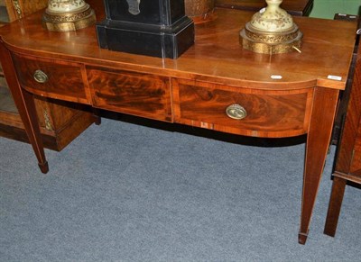 Lot 666 - An early 19th century mahogany sideboard with two frieze drawers and spade feet, 137cm wide