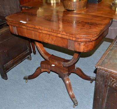 Lot 669 - A Regency mahogany fold over card table on four out swept feet, 92cm wide