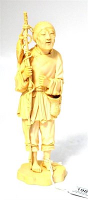 Lot 198 - A Japanese Ivory Okimono, Meiji period, of a fisherman standing in traditional costume, a rod...