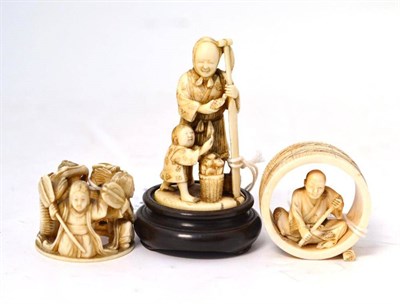 Lot 200 - A Japanese Ivory Okimono, Meiji period, as a mother and child, she holding a paddle, a basket...