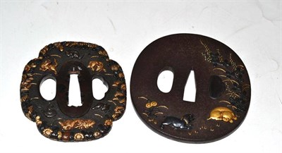Lot 206 - A Japanese Iron Tsuba, 19th century, inlaid in gold and silver with dogs amongst foliage,...