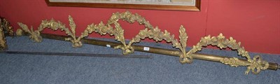 Lot 1168 - Gilt metal pole with decorative swag