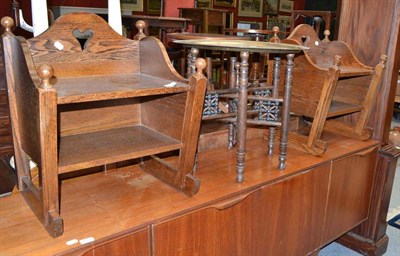 Lot 1266 - A pair of Arts & Crafts style oak cabinets with pierced heart motif and a tray top table