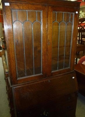 Lot 1279 - An oak bureau bookcase and an oak chest of drawers