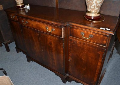 Lot 1284 - A reproduction break fronted sideboard