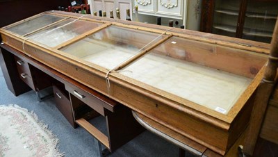 Lot 1287 - A wide glazed oak museum style display cabinet