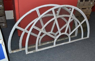 Lot 1302 - A pair of 'D' or fan-shaped glazed windows with metal frames