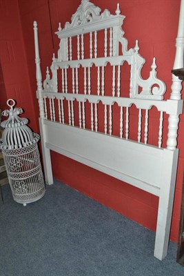 Lot 1304 - A painted white metal bird cage and a painted bed head