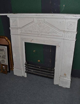 Lot 1318 - White painted cast iron fire surround