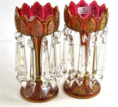 Lot 5 - A pair of ruby lustre vases with gilt decoration