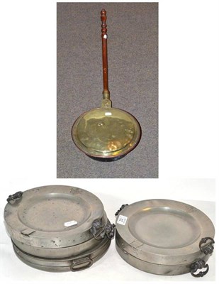 Lot 22 - A brass bed warmer, five pewter food warmers and a Le Nove plaque (a.f.) (7)