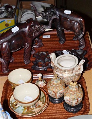 Lot 25 - A pair of Chinese hardwood elephants and stands, a pair of Japanese vases and covers, cups and...