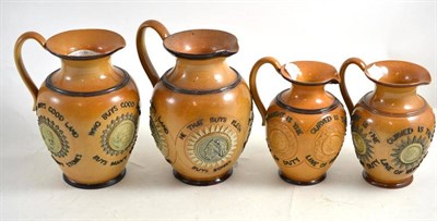 Lot 26 - A Doulton Lambeth motto jug sprigged with ";Who buys good ale buys nothing else"; and three similar