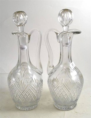 Lot 28 - A pair of cut glass claret jugs