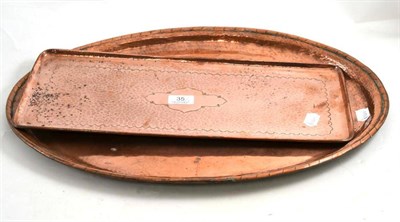 Lot 35 - Newlyn rectangular tray and a Wallis oval copper tray (2)
