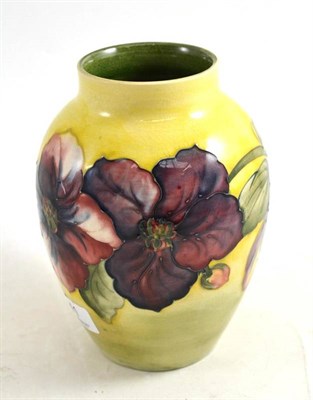 Lot 41 - A Moorcroft pottery vase on a yellow ground