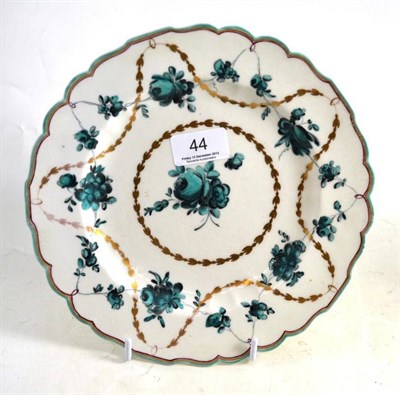 Lot 44 - A Chelsea-Derby porcelain dessert plate, circa 1775, painted in green monochrome with flower...