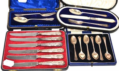 Lot 52 - A cased set of six silver coffee spoons and three other cased sets