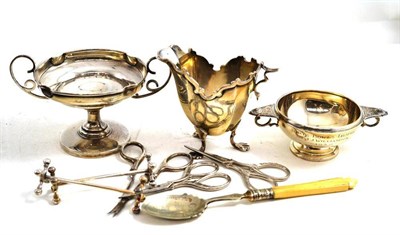 Lot 68 - Silver porringer dated 1939, silver trophy cup, cream jug, knife rests, silver handled scissors etc