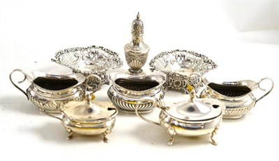 Lot 83 - A silver three piece condiment set, two silver mustard pots and covers, a pepperette and two bonbon