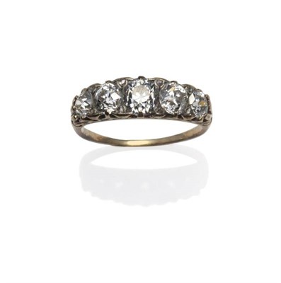 Lot 241 - A Victorian Diamond Five Stone Ring, the old cut diamonds spaced by pairs of tiny rose cut...