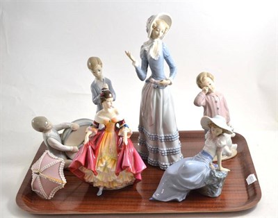 Lot 122 - A Lladro figure of a woman, Lladro group of two boys, two Nao figures and a Doulton figure (5)