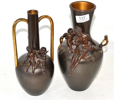 Lot 137 - A bronzed spelter two handled vase, surmounted by a Classical maiden and a putto and a similar...