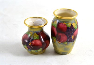 Lot 140 - Two modern Moorcroft Pomegranate pattern enamel vases