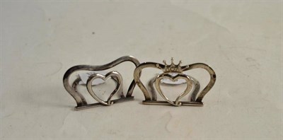 Lot 147 - A pair of modern Scottish silver place card holders each modelled with a heart, one with a...