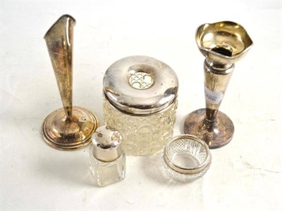 Lot 153 - Two small loaded silver specimen vases, a silver topped glass hair tidy, smelling salts bottle...