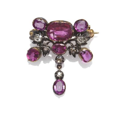 Lot 248 - A Ruby and Diamond Brooch, seven mixed cut rubies in yellow collet settings, and six old cut...