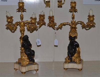 Lot 162 - A pair French bronze and ormolu three-branch candelabra, 19th century, with foliate scroll cast...