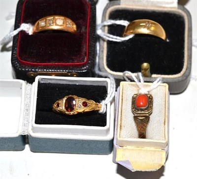 Lot 175 - Four rings comprising a garnet and diamond ring, a coral ring, a split pearl ring and another