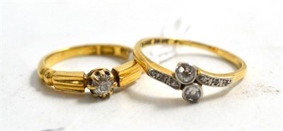 Lot 186 - An 18ct gold diamond solitaire ring and a diamond two stone crossover ring (2)