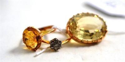 Lot 187 - An 18ct gold and diamond cluster ring, a 9ct gold and citrine ring and a citrine set brooch