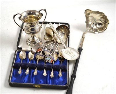 Lot 189 - A silver toddy ladle, a cased set of six silver coffee spoons, a small silver trophy cup and a...