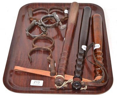 Lot 213 - Three pairs of handcuffs and three truncheons