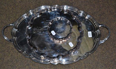 Lot 220 - An Edwardian silver plated two handled tray; a plated `Arthur Jones Perpetual Salver' and a similar