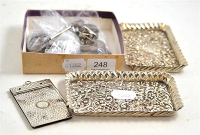 Lot 248 - A pair of foliate embossed small rectangular silver pin trays, Birmingham 1900; a small...