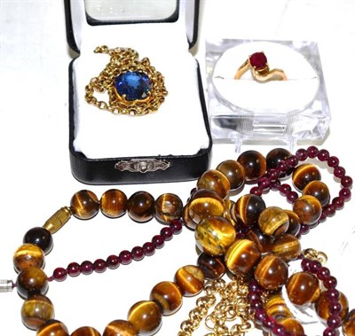 Lot 260 - A 9ct gold belcher necklace, a tiger's eye bead necklace, and another bead necklace, a...