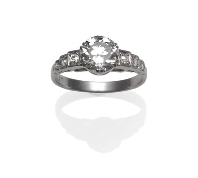 Lot 259 - A Diamond Solitaire Ring, circa 1940, the round brilliant cut diamond in a white double claw...