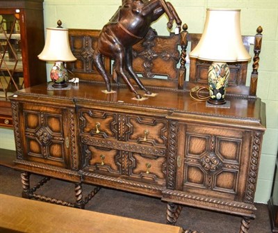 Lot 346 - A Geometric carved oak sideboard on barley twist supports