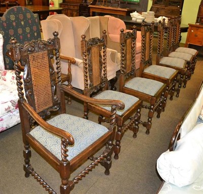 Lot 348 - Set of seven oak caned back dining chairs on barley twist supports including a carver