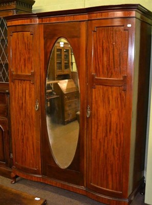 Lot 356 - Edwardian mahogany reverse break front triple wardrobe