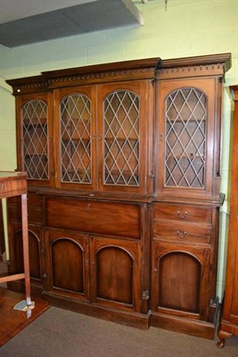 Lot 357 - A large modern mahogany secretaire bookcase with leaded glazed doors