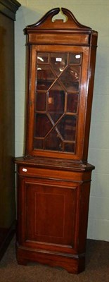 Lot 359 - A Georgian style mahogany small standing corner cupboard with glazed upper section