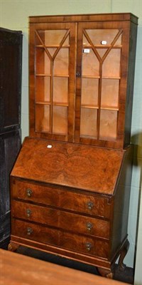 Lot 361 - A walnut bureau with later glazed top