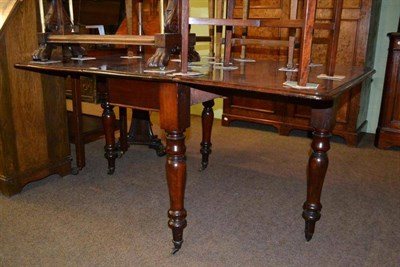 Lot 372 - A Victorian mahogany drop leaf dining table