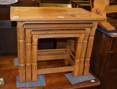 Lot 387 - Nest of three oak Mouseman style tables