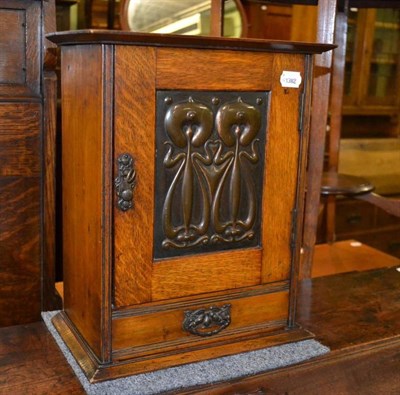 Lot 390 - Art Nouveau oak smokers cabinet